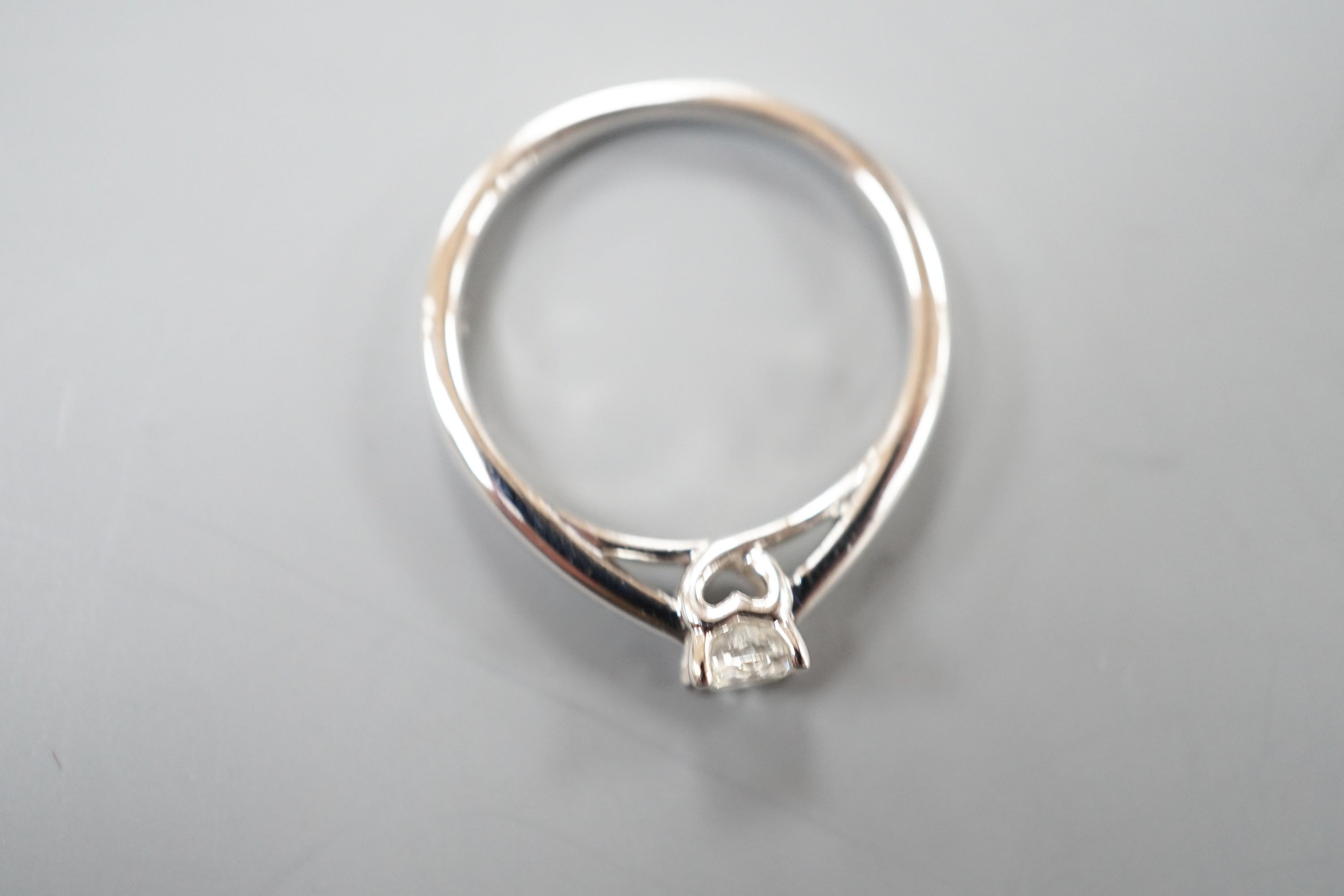 A modern 9k white metal and solitaire diamond ring, the stone weighing 0.33ct, size L, gross weight 2.5 grams.